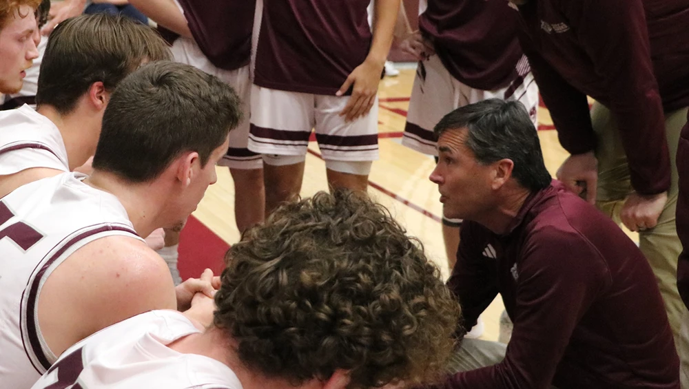 Coach taking down stats during a game